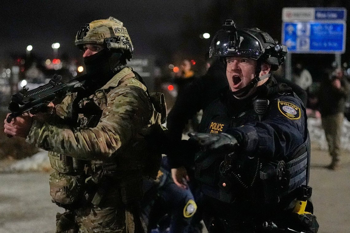 Federal immigration officers confront protesters outside Bishop Henry Whipple Federal Building, Thursday, Jan. 15, 2026, in Minneapolis. (AP Photo/Yuki Iwamura) Federal immigration officers confront protesters outside Bishop Henry Whipple Federal Building, Thursday, Jan. 15, 2026, in Minneapolis. (AP Photo/Yuki Iwamura)