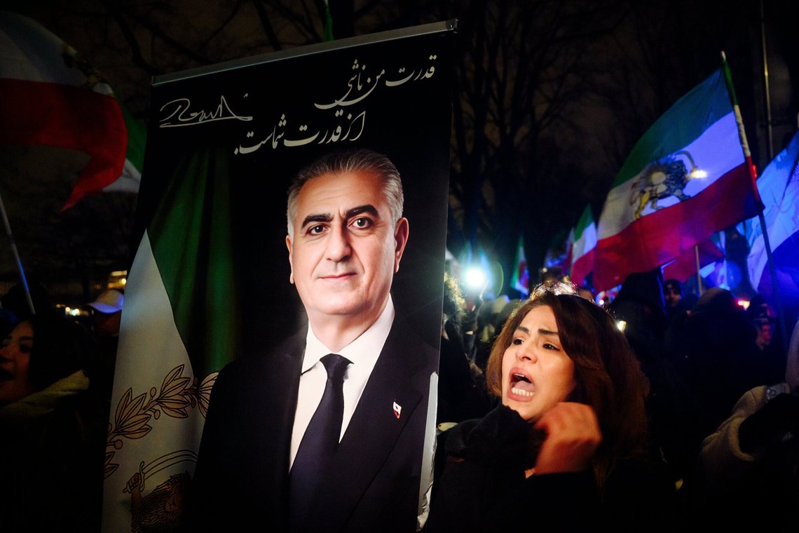 A participant walks with a portrait of the son of the last Shah of Iran, Reza Pahlavi, in protest against the Iranian government, the spiritual leaders and in solidarity with the recent protests in the Islamic country during a rally around the Binnenalster in Hamburg, Germany on Saturday, Jan. 24, 2026. (Gregor Fischer/dpa via AP) A participant walks with a portrait of the son of the last Shah of Iran, Reza Pahlavi, in protest against the Iranian government, the spiritual leaders and in solidarity with the recent protests in the Islamic country during a rally around the Binnenalster in Hamburg, Germany on Saturday, Jan. 24, 2026. (Gregor Fischer/dpa via AP)