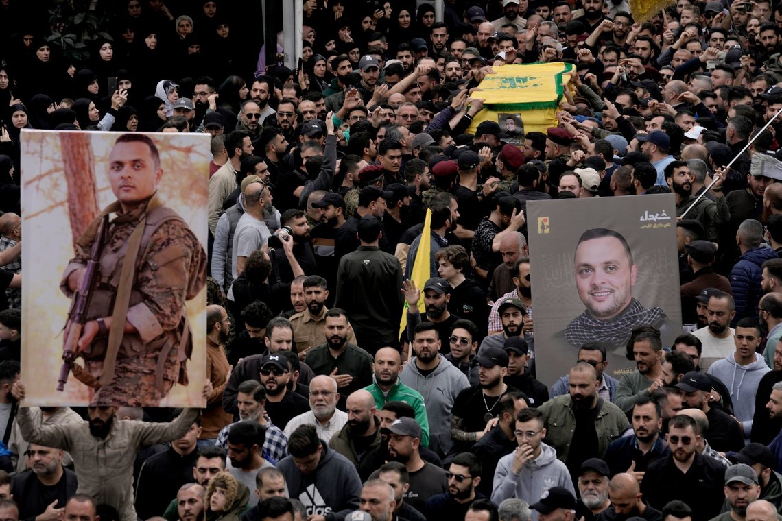 Hezbollah fighters carry the coffin of their comrade, Ali Ahmad Hussein, who was killed by an Israeli strike in south Lebanon, during his funeral procession in the southern Beirut suburb of Dahiyeh, Lebanon, Monday, April 8, 2024. Israel's military says it has killed a commander of Hezbollah's secretive Radwan Force in southern Lebanon. (AP Photo/Bilal Hussein) Hezbollah fighters carry the coffin of their comrade, Ali Ahmad Hussein, who was killed by an Israeli strike in south Lebanon, during his funeral procession in the southern Beirut suburb of Dahiyeh, Lebanon, Monday, April 8, 2024. Israel's military says it has killed a commander of Hezbollah's secretive Radwan Force in southern Lebanon. (AP Photo/Bilal Hussein)
