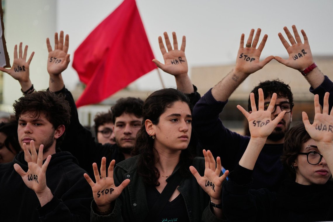 People raise their hands during a protest calling for an end to the war in Tel Aviv, Israel, Saturday, April 4, 2026. (AP Photo/Maya Levin) People raise their hands during a protest calling for an end to the war in Tel Aviv, Israel, Saturday, April 4, 2026. (AP Photo/Maya Levin)