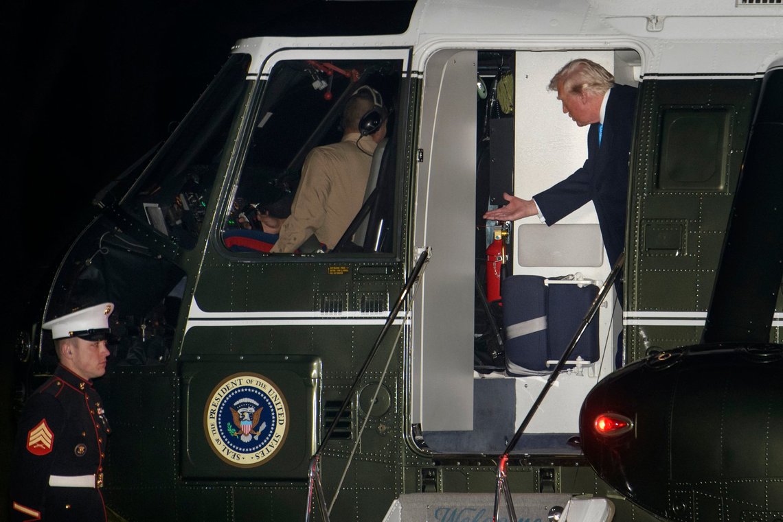 President Donald Trump talks with the pilot as he disembarks Marine One upon arrival on the South Lawn of the White House in Washington, Sunday, Feb. 2, 2025. (AP Photo/Rod Lamkey, Jr.) President Donald Trump talks with the pilot as he disembarks Marine One upon arrival on the South Lawn of the White House in Washington, Sunday, Feb. 2, 2025. (AP Photo/Rod Lamkey, Jr.)