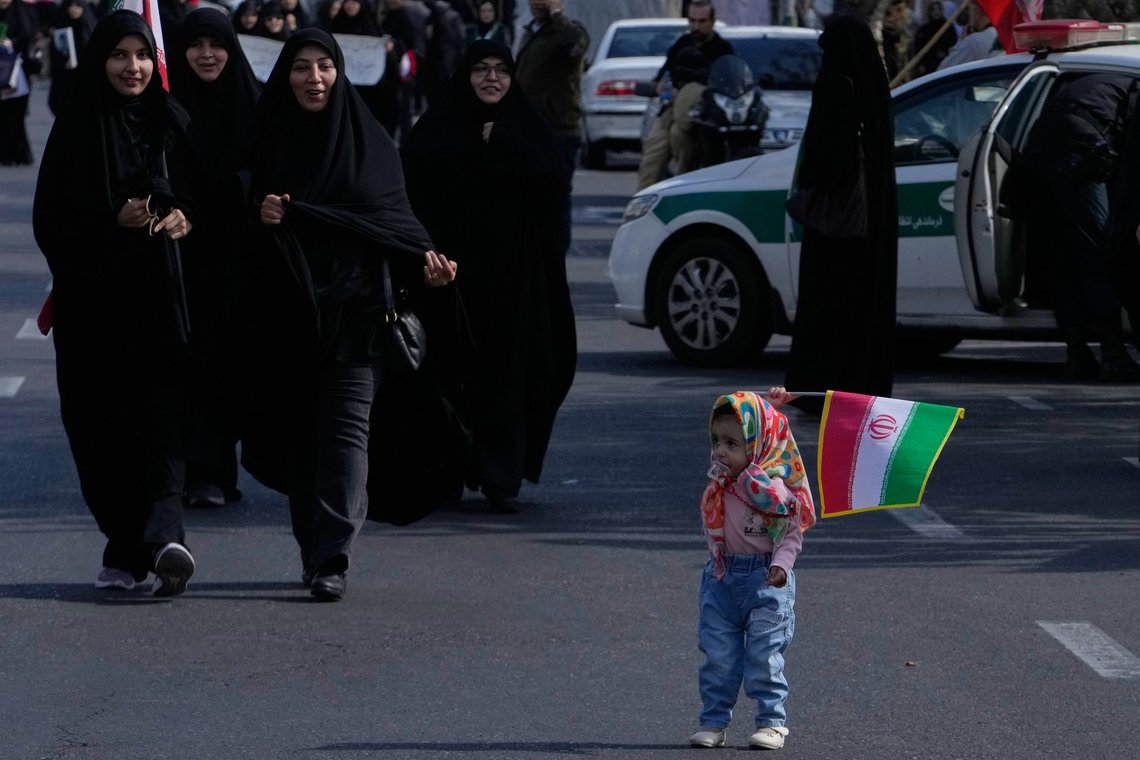 A girl holds an Iranian flag during a memorial for school children who were killed during a strike on a school in southern town of Minab on Feb. 28, in downtown Tehran, Iran, Tuesday, April 7, 2026. (AP Photo/Vahid Salemi) A girl holds an Iranian flag during a memorial for school children who were killed during a strike on a school in southern town of Minab on Feb. 28, in downtown Tehran, Iran, Tuesday, April 7, 2026. (AP Photo/Vahid Salemi)