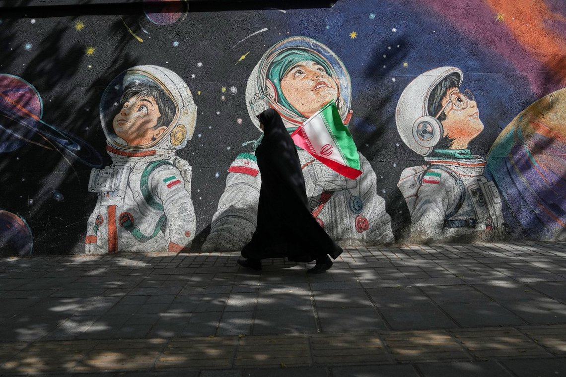 A woman walks past a mural in Tehran, Iran, Wednesday, April 8, 2026. (AP Photo/Francisco Seco) A woman walks past a mural in Tehran, Iran, Wednesday, April 8, 2026. (AP Photo/Francisco Seco)