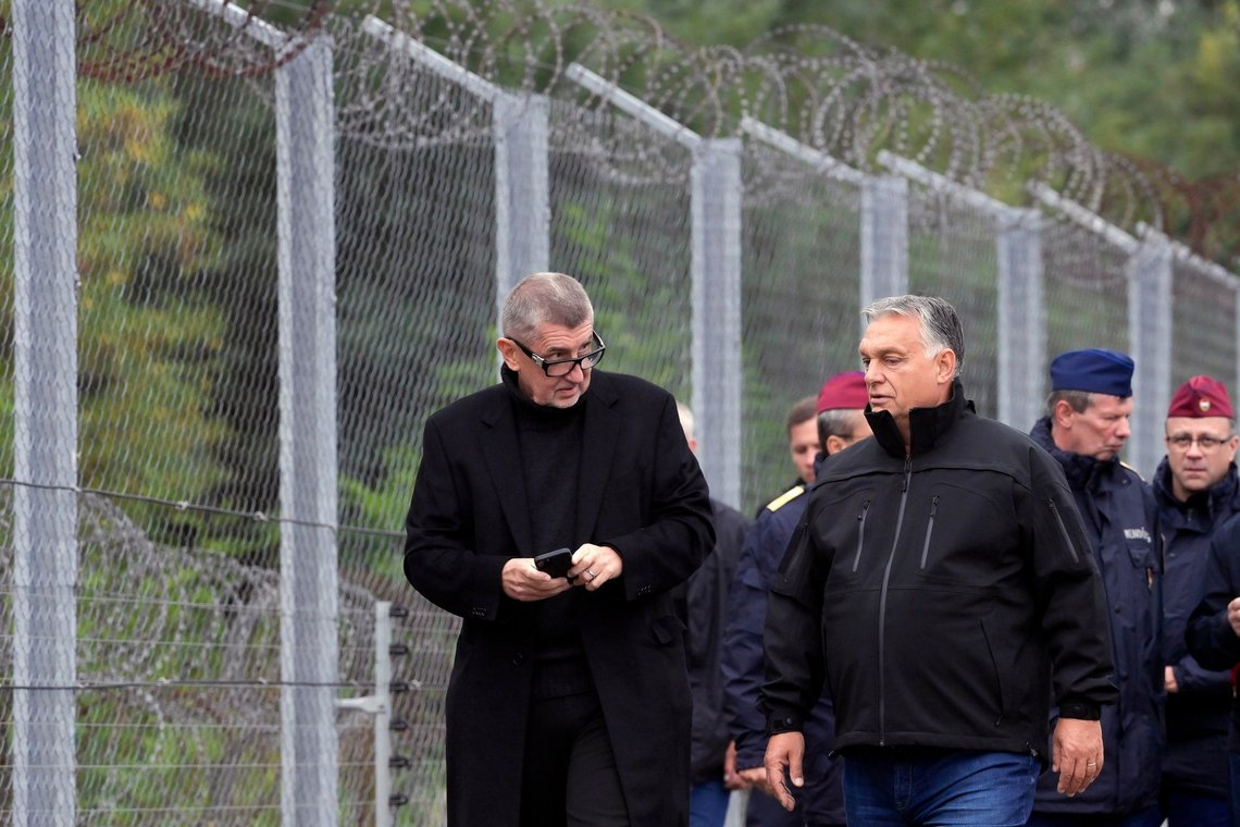 Hungarian Prime Minister Viktor Orban, right, and his Czech counterpart, Andrej Babis walk before a joint press conference during their visit at the temporary security border fence in Roszke on the Hungarian-Serbian border, Hungary, Wednesday, Sept. 22, 2021. (Szilard Koszticsak/MTI via AP) Hungarian Prime Minister Viktor Orban, right, and his Czech counterpart, Andrej Babis walk before a joint press conference during their visit at the temporary security border fence in Roszke on the Hungarian-Serbian border, Hungary, Wednesday, Sept. 22, 2021. (Szilard Koszticsak/MTI via AP)