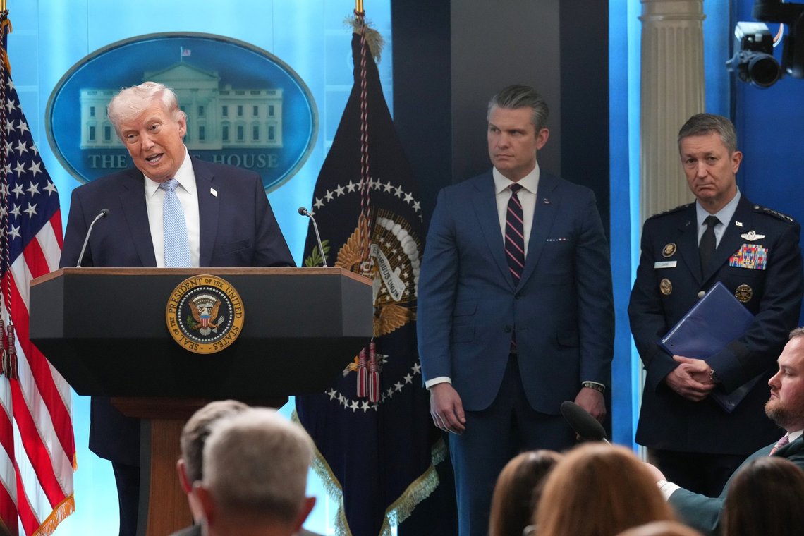 FILE - President Donald Trump speaks with reporters during a news conference in the James Brady Press Briefing Room at the White House, Monday, April 6, 2026, in Washington, as Defense Secretary Pete Hegseth and Chairman of the Joint Chiefs of Staff Gen. Dan Caine listen. (AP Photo/Mark Schiefelbein, File) FILE - President Donald Trump speaks with reporters during a news conference in the James Brady Press Briefing Room at the White House, Monday, April 6, 2026, in Washington, as Defense Secretary Pete Hegseth and Chairman of the Joint Chiefs of Staff Gen. Dan Caine listen. (AP Photo/Mark Schiefelbein, File)