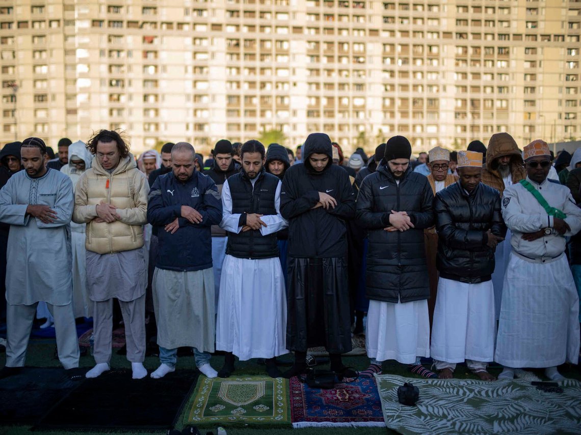 Muslim worshippers offer Eid al-Fitr prayers marking the end of the holy fasting month of Ramadan at the Malpasse soccer stadium in Marseille, southern France, Wednesday, April 10, 2024. (AP Photo/Daniel Cole) Muslim worshippers offer Eid al-Fitr prayers marking the end of the holy fasting month of Ramadan at the Malpasse soccer stadium in Marseille, southern France, Wednesday, April 10, 2024. (AP Photo/Daniel Cole)