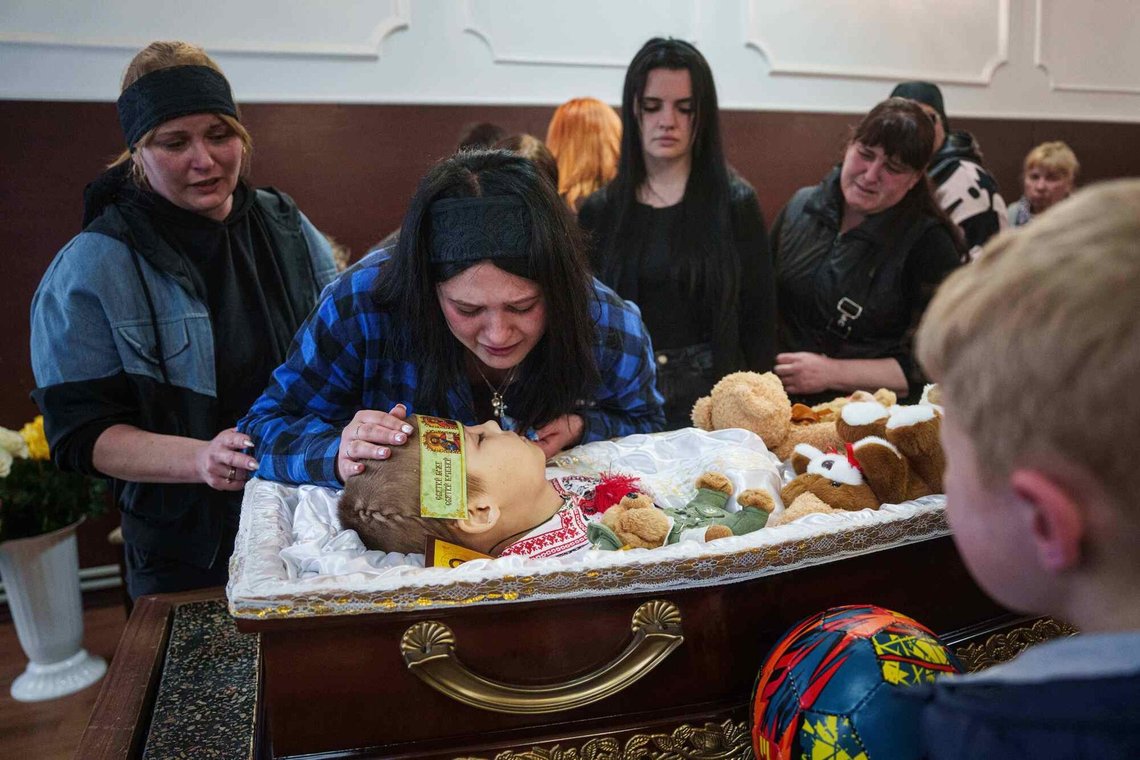 A family members pays her final respects to 8-year-old Bohdan Serhiiev who was killed in a Russian drone attack, during a farewell ceremony in Cherkasy, Ukraine, Thursday, April 16, 2026. (AP Photo/Evgeniy Maloletka) A family members pays her final respects to 8-year-old Bohdan Serhiiev who was killed in a Russian drone attack, during a farewell ceremony in Cherkasy, Ukraine, Thursday, April 16, 2026. (AP Photo/Evgeniy Maloletka)