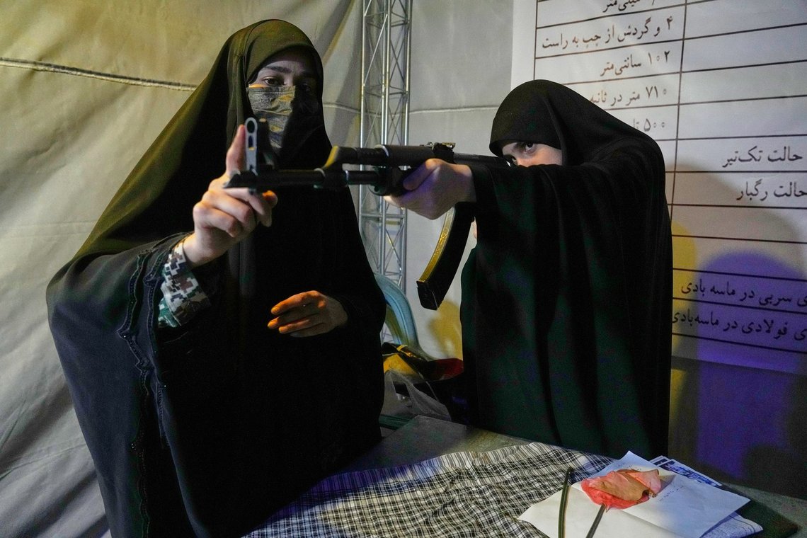 A member of the Revolutionary Guard's volunteer Basij force, left, gives instructions on how to handle a Kalashnikov-style assault rifle during a weapons training class in Tehran, Iran, Tuesday, May 19, 2026. (AP Photo/Vahid Salemi) A member of the Revolutionary Guard's volunteer Basij force, left, gives instructions on how to handle a Kalashnikov-style assault rifle during a weapons training class in Tehran, Iran, Tuesday, May 19, 2026. (AP Photo/Vahid Salemi)