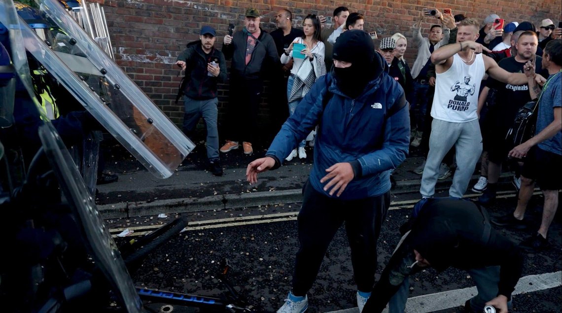 In this image taken from PA Video, police and protestors clash during a protest following the death of Henry Nowak, a 18-year-old student stabbed to death with a Sikh kirpan ceremonial by Vickrum Digwa, in Southampton, England, Tuesday June 2, 2026. (Jamie Lashmar/PA via AP) In this image taken from PA Video, police and protestors clash during a protest following the death of Henry Nowak, a 18-year-old student stabbed to death with a Sikh kirpan ceremonial by Vickrum Digwa, in Southampton, England, Tuesday June 2, 2026. (Jamie Lashmar/PA via AP)