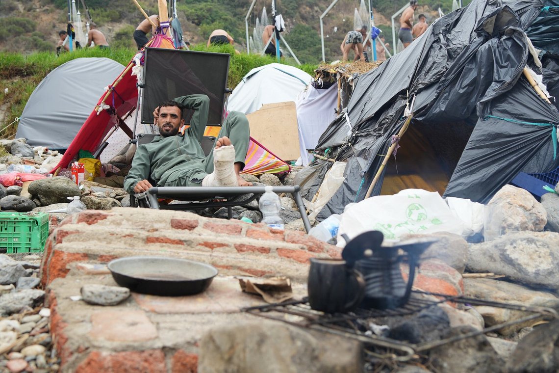 A migrant sits next to his tent at El Trampolín beach in the Spanish exclave of Ceuta, Wednesday, Sept. 2, 2026. (AP Photo/Francis González) A migrant sits next to his tent at El Trampolín beach in the Spanish exclave of Ceuta, Wednesday, Sept. 2, 2026. (AP Photo/Francis González)