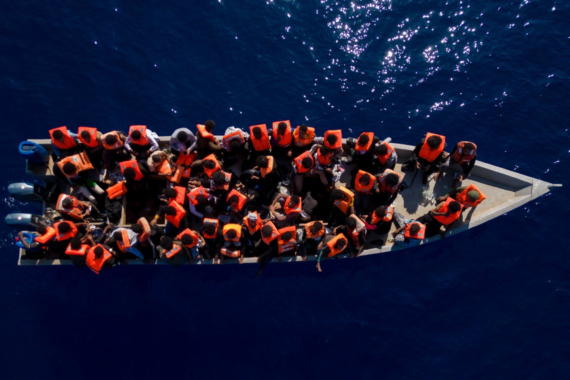 FILE - Migrants from Eritrea, Libya and Sudan sail a wooden boat before being assisted by aid workers of the Spanish NGO Open Arms, in the Mediterranean sea, about 30 miles north of Libya, Saturday, June 17, 2023. (AP Photo/Joan Mateu Parra, File) FILE - Migrants from Eritrea, Libya and Sudan sail a wooden boat before being assisted by aid workers of the Spanish NGO Open Arms, in the Mediterranean sea, about 30 miles north of Libya, Saturday, June 17, 2023. (AP Photo/Joan Mateu Parra, File)