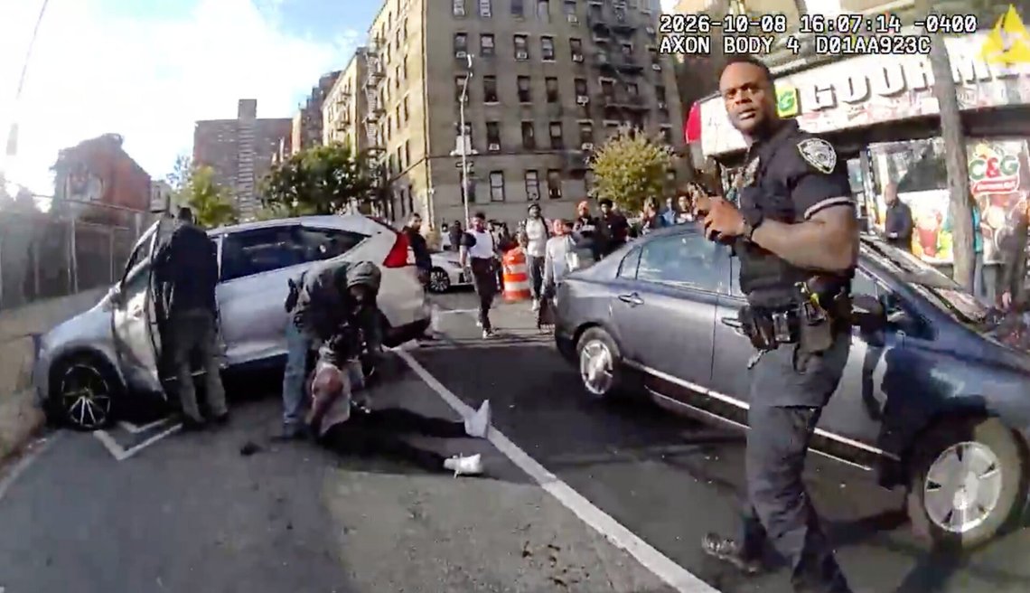 In this image taken from police-worn body camera video released the New York City Police Department (NYPD), law enforcement personnel tend to a Oscar Belgal, 28, a Dominican man who was shot by Federal immigration officers, Thursday, Oct. 8, 2026, in New York, as he drove his car with a 5-year-old boy inside. (NYPD via AP) In this image taken from police-worn body camera video released the New York City Police Department (NYPD), law enforcement personnel tend to a Oscar Belgal, 28, a Dominican man who was shot by Federal immigration officers, Thursday, Oct. 8, 2026, in New York, as he drove his car with a 5-year-old boy inside. (NYPD via AP)
