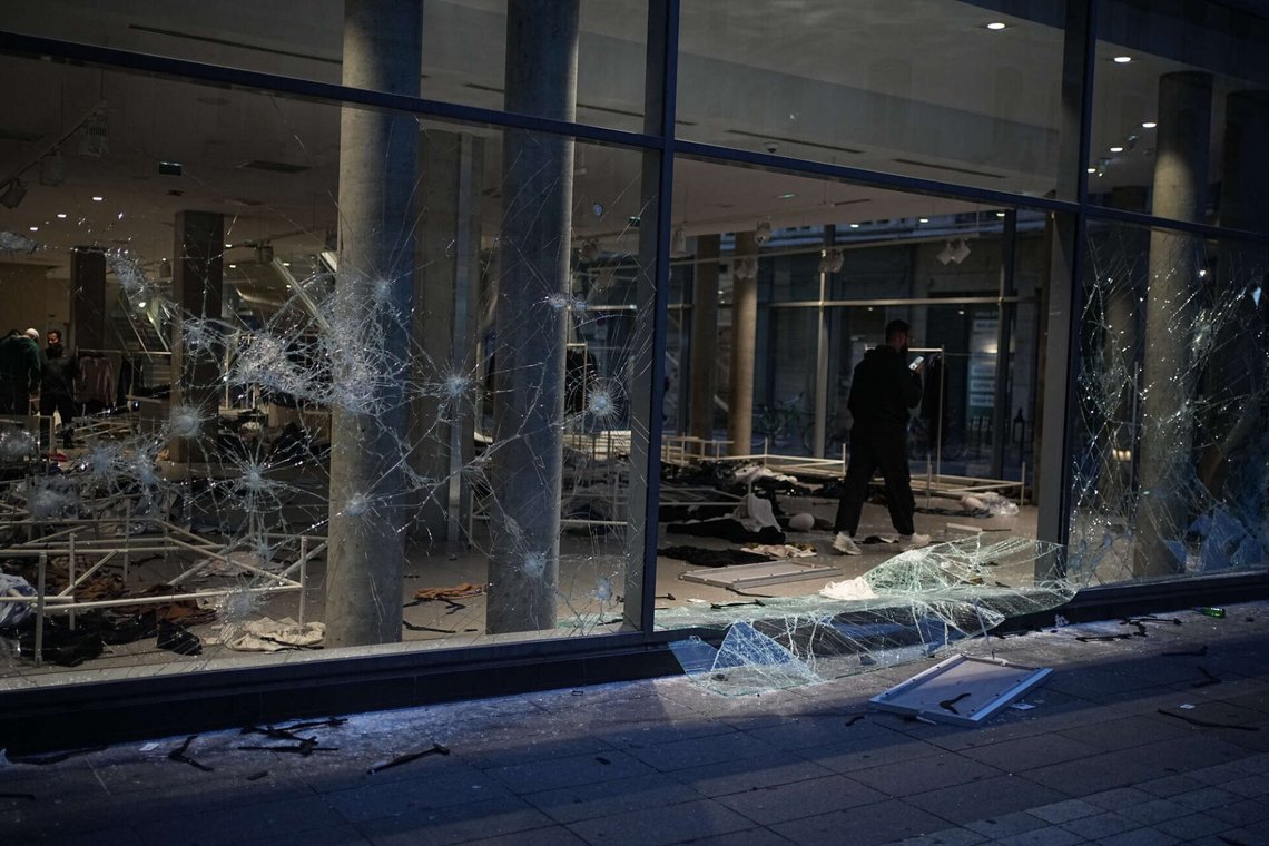 A man takes photos of a looted store after a demonstration against rising living costs, joining students' grievances, in Lyon, France, Saturday, Oct. 17, 2026. (AP Photo/Laurent Cipriani) A man takes photos of a looted store after a demonstration against rising living costs, joining students' grievances, in Lyon, France, Saturday, Oct. 17, 2026. (AP Photo/Laurent Cipriani)