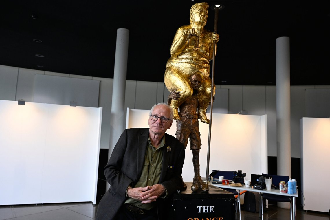 Danish artist Jens Galschiot poses next to his sculpture "The Orange Plague", depicting U.S. President Donald Trump, on display at the European Parliament building in Strasbourg, France, Wednesday Oct. 7, 2026. (AP Photo/Pascal Bastien) Danish artist Jens Galschiot poses next to his sculpture "The Orange Plague", depicting U.S. President Donald Trump, on display at the European Parliament building in Strasbourg, France, Wednesday Oct. 7, 2026. (AP Photo/Pascal Bastien)