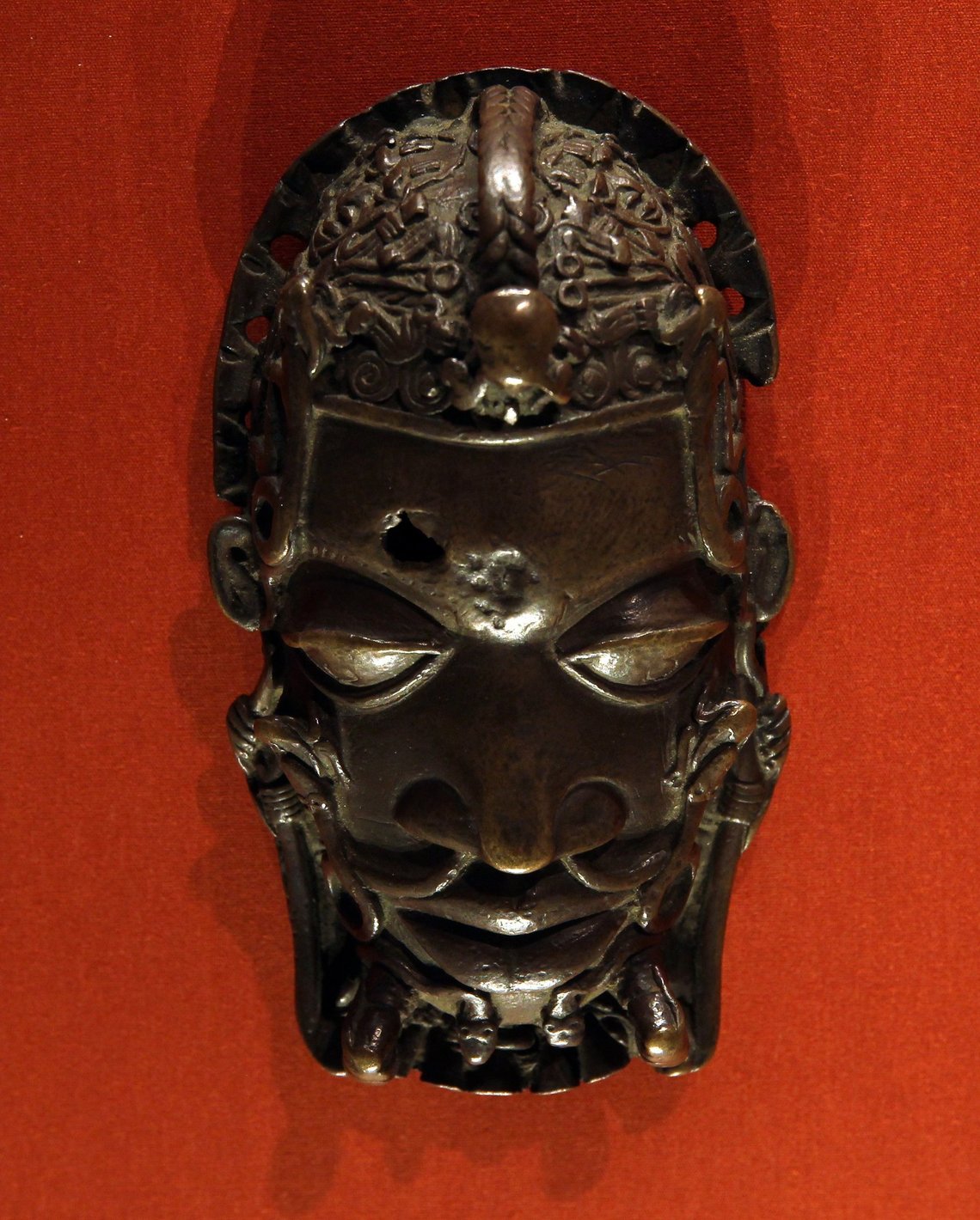Costume mask, brass, 16th century, from Benin / Nigeria.These masks were regalia, worn by senior officials over the left hip and returned to the king on loss of office or death. Room 25, British Museum.Vassil, CC0, Wikimedia Commons Costume mask, brass, 16th century, from Benin / Nigeria.These masks were regalia, worn by senior officials over the left hip and returned to the king on loss of office or death. Room 25, British Museum.Vassil, CC0, Wikimedia Commons