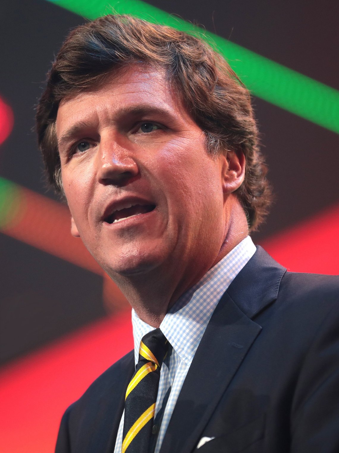 FILE - Tucker Carlson speaking with attendees at the 2020 Student Action Summit . A racist text message from Tucker Carlson is what helped drive the commentator's ouster from Fox News, The New York Times reports. The Times says that in a text uncovered as part of a recent defamation lawsuit, the former Fox host lamented how supporters of former President Donald Trump ganged up to beat a protester. "It's not how white men fight," Carlson wrote. (Gage Skidmore from Surprise, AZ, United States of America, CC BY-SA 2.0, Wikimedia Commons) FILE - Tucker Carlson speaking with attendees at the 2020 Student Action Summit . A racist text message from Tucker Carlson is what helped drive the commentator's ouster from Fox News, The New York Times reports. The Times says that in a text uncovered as part of a recent defamation lawsuit, the former Fox host lamented how supporters of former President Donald Trump ganged up to beat a protester. "It's not how white men fight," Carlson wrote. (Gage Skidmore from Surprise, AZ, United States of America, CC BY-SA 2.0, Wikimedia Commons)