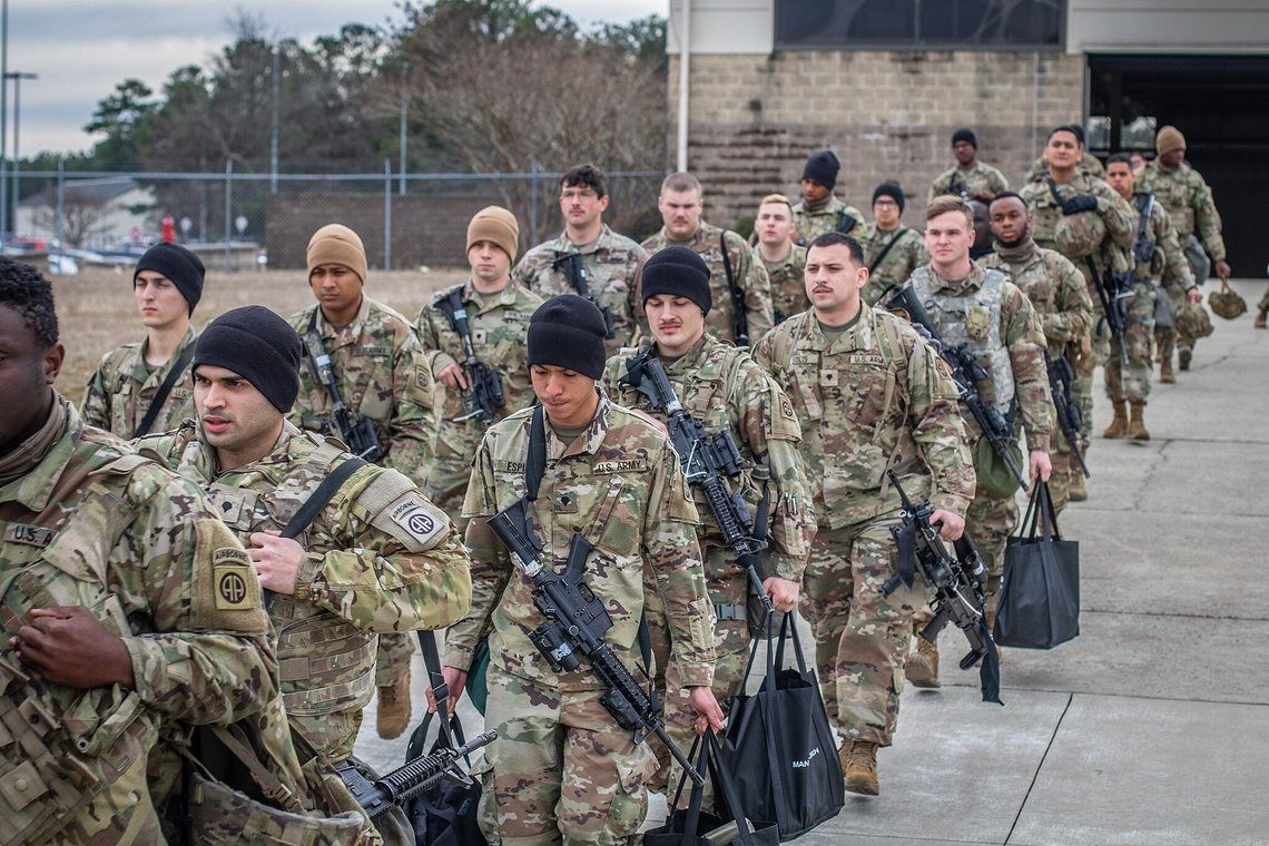 Soldiers from the 82nd Airborne Division and the 18th Airborne Corps file onto a U.S. Air Force C-17 Globemaster III aircraft at Fort Bragg, North Carolina, Feb. 8, 2022. The Soldiers were deployed to Eastern Europe as directed by the U.S. Secretary of Defense to assure the United States NATO allies and deter Russian aggression. At a NATO summit on Thursday, March 24, 2022 leaders discussed the longer-term future of NATO's defences along its eastern flank, ranging from Estonia in the north, down to around Western Ukraine to Bulgaria on the Black Sea. Photo: Staff Sgt. Jeremiah Meaney, Public domain, via Wikimedia Commons Soldiers from the 82nd Airborne Division and the 18th Airborne Corps file onto a U.S. Air Force C-17 Globemaster III aircraft at Fort Bragg, North Carolina, Feb. 8, 2022. The Soldiers were deployed to Eastern Europe as directed by the U.S. Secretary of Defense to assure the United States NATO allies and deter Russian aggression. At a NATO summit on Thursday, March 24, 2022 leaders discussed the longer-term future of NATO's defences along its eastern flank, ranging from Estonia in the north, down to around Western Ukraine to Bulgaria on the Black Sea. Photo: Staff Sgt. Jeremiah Meaney, Public domain, via Wikimedia Commons