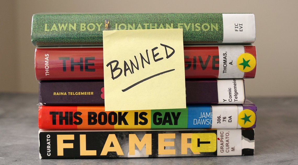 Chicago, IL, USA - May 10 2023: A stack of books found on frequently banned book lists with a sticky note saying "banned". Photo: Shutterstock by On the Run Photo. Chicago, IL, USA - May 10 2023: A stack of books found on frequently banned book lists with a sticky note saying "banned". Photo: Shutterstock by On the Run Photo.
