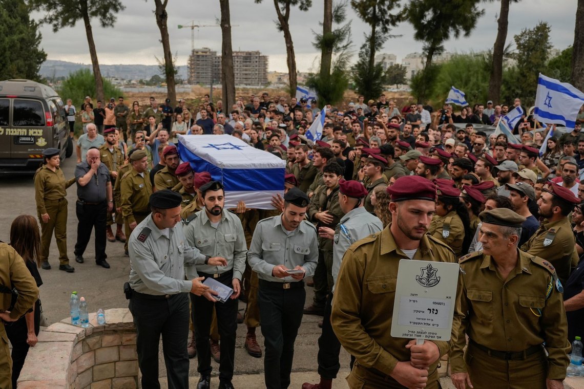Israeli soldiers carry the flag-draped coffin of Sergeant First Class Nazar Itkin, who was killed during Israel's ground operation against Hezbollah terrorists in Lebanon, during his funeral in Kiryat Ata, Israel, Sunday, Oct. 6, 2024. Photo: AP /Baz Ratner/ NTB Israeli soldiers carry the flag-draped coffin of Sergeant First Class Nazar Itkin, who was killed during Israel's ground operation against Hezbollah terrorists in Lebanon, during his funeral in Kiryat Ata, Israel, Sunday, Oct. 6, 2024. Photo: AP /Baz Ratner/ NTB