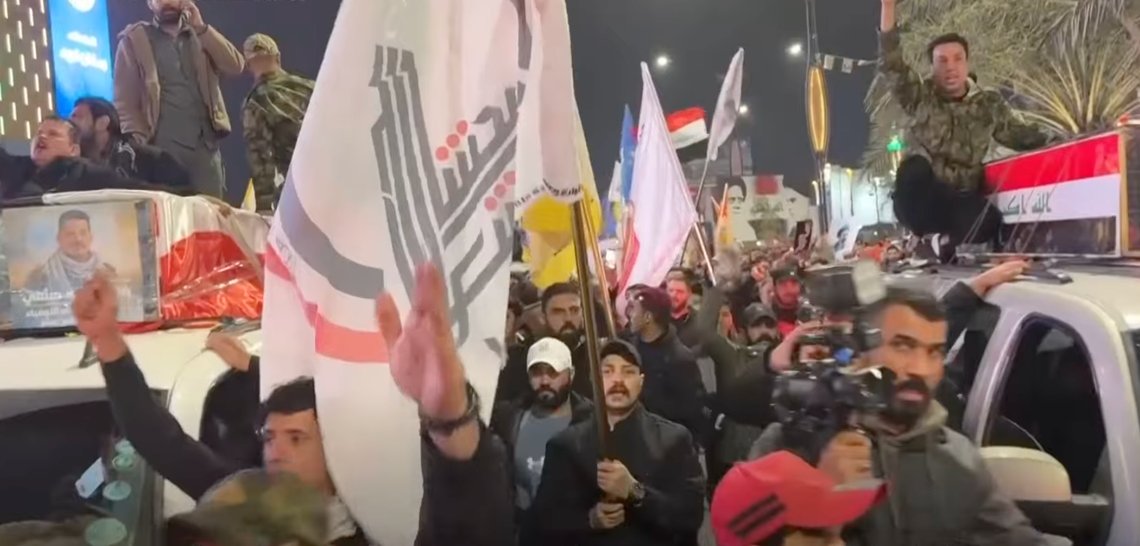Mourners carry the coffin of members of Iraq’s Popular Mobilisation Forces (Hashd al-Shaabi), an Iranian regime outfit, during a funeral procession, with militia flags and crowds gathered in Baghdad. Video still via YouTube. Mourners carry the coffin of members of Iraq’s Popular Mobilisation Forces (Hashd al-Shaabi), an Iranian regime outfit, during a funeral procession, with militia flags and crowds gathered in Baghdad. Video still via YouTube.