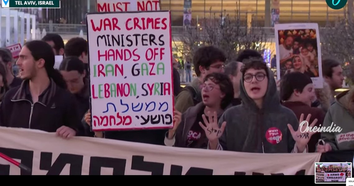 People raising their hands during a demonstration calling for an end to the war, in Tel Aviv on 4 April 2026. Video still from YouTube. People raising their hands during a demonstration calling for an end to the war, in Tel Aviv on 4 April 2026. Video still from YouTube.