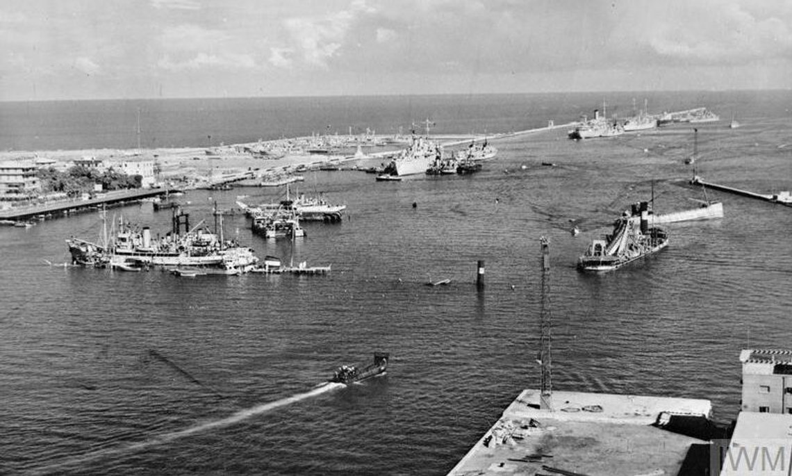 Scuttled ships at the entrance to the Suez Canal, at Port Said, Nov. 19, 1956, as seen from over Port Fuad. Port Said can be seen in the background. Flag poles rising from the water pinpoint other completely sunken ships. Photo: Public domain / Imperial War Museum Scuttled ships at the entrance to the Suez Canal, at Port Said, Nov. 19, 1956, as seen from over Port Fuad. Port Said can be seen in the background. Flag poles rising from the water pinpoint other completely sunken ships. Photo: Public domain / Imperial War Museum