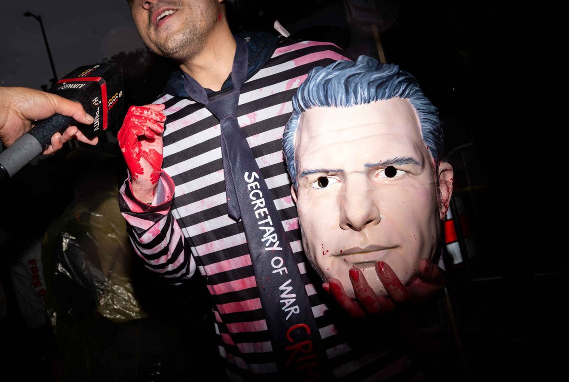 A protester holding a Pete Hegseth costume gives an interview outside of the White House Correspondents Dinner, Saturday, April 25, 2026, in Washington. A protester holding a Pete Hegseth costume gives an interview outside of the White House Correspondents Dinner, Saturday, April 25, 2026, in Washington.