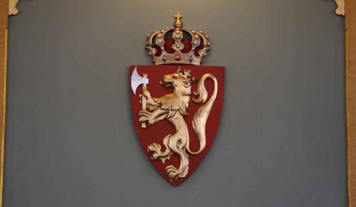 Coat of Arms of Norway, with the pre-1939 lion, before the adoption of the more austere medieval-style redesign. Coat of Arms of Norway, with the pre-1939 lion, before the adoption of the more austere medieval-style redesign.