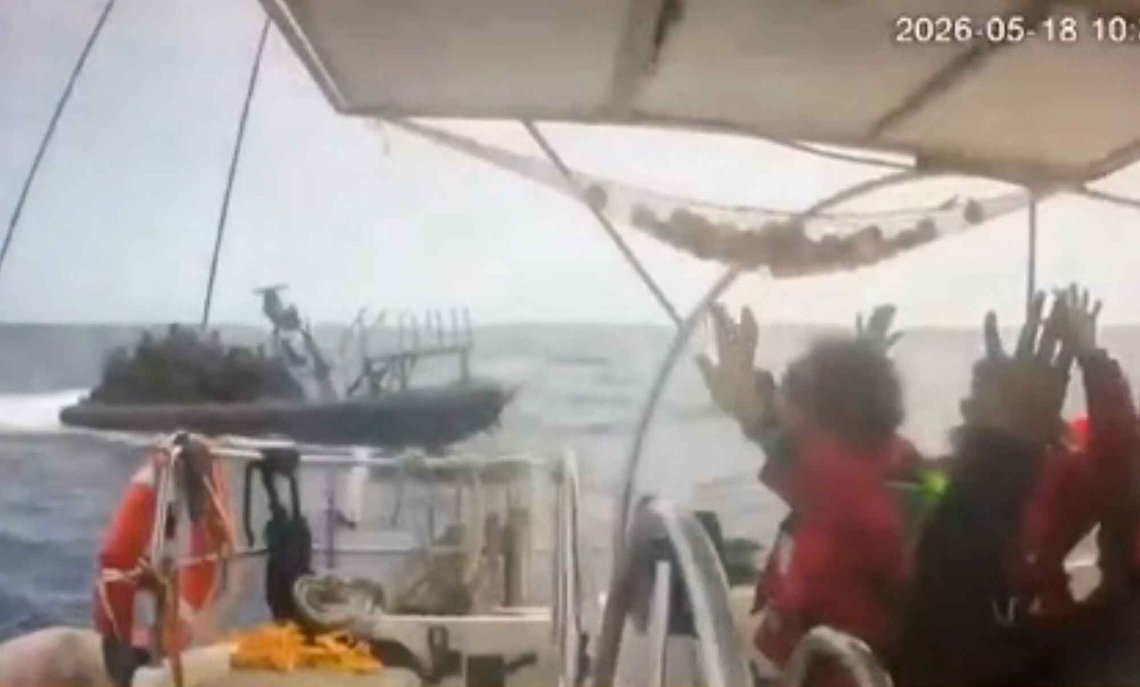 This grab from CCTV footage shows activists aboard a flotilla boat with their hands in the air as a boat approaches one of more than 50 vessels that departed from the port of Marmaris, Turkey, last week in what organizers of the Global Sumud Flotilla described as the final leg of their planned journey to Gaza's shores, in international waters Monday, May 18, 2026. (Global Sumud Flotilla via AP) This grab from CCTV footage shows activists aboard a flotilla boat with their hands in the air as a boat approaches one of more than 50 vessels that departed from the port of Marmaris, Turkey, last week in what organizers of the Global Sumud Flotilla described as the final leg of their planned journey to Gaza's shores, in international waters Monday, May 18, 2026. (Global Sumud Flotilla via AP)