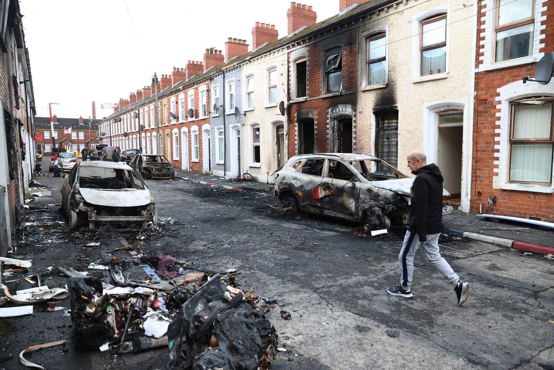 A man walks down a street after rioting broke out late Tuesday, in east Belfast, Northern Ireland, Wednesday, June 10, 2026, following a stabbing incident. A man walks down a street after rioting broke out late Tuesday, in east Belfast, Northern Ireland, Wednesday, June 10, 2026, following a stabbing incident.