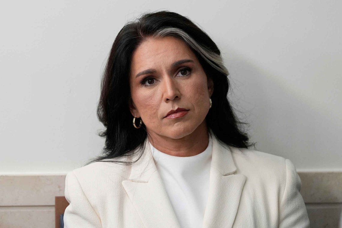 FILE - Director of National Intelligence Tulsi Gabbard sits in the James Brady Press Briefing Room at the White House, July 23, 2025, in Washington. FILE - Director of National Intelligence Tulsi Gabbard sits in the James Brady Press Briefing Room at the White House, July 23, 2025, in Washington.