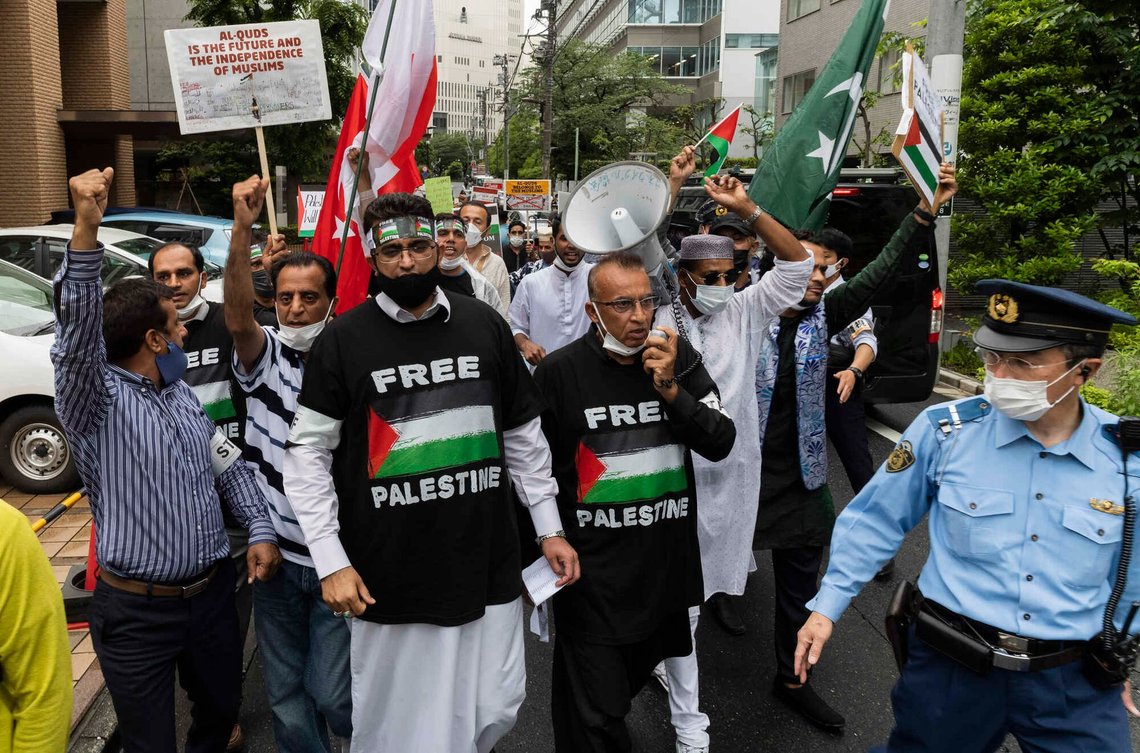 Group of Muslims from different countries and living in Japan march towards the Israeli Embassy in Tokyo on Friday, May 21, 2021, against they protest against the recent Israel Palestinian conflict in Gaza. Group of Muslims from different countries and living in Japan march towards the Israeli Embassy in Tokyo on Friday, May 21, 2021, against they protest against the recent Israel Palestinian conflict in Gaza.