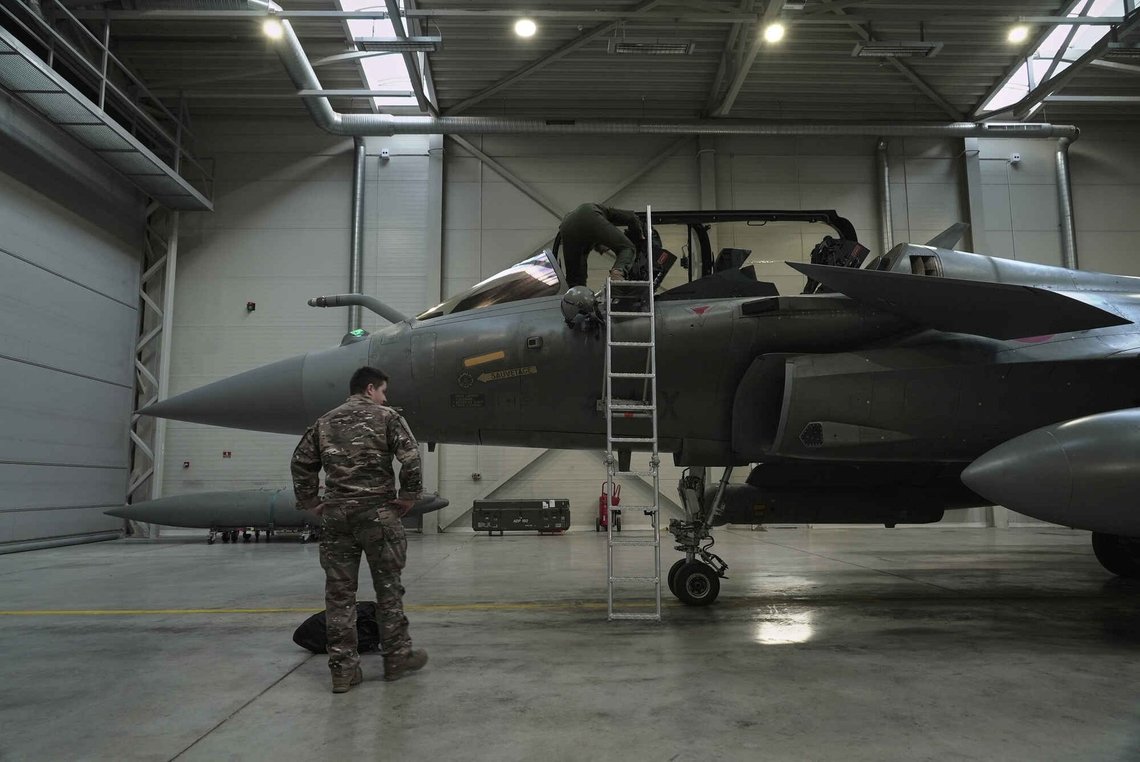 A flight-crew member climbs into the cockpit of a French air force Rafale fighter jet stationed on a NATO air-policing mission at the Siauliai Air Base in Lithuania as another member of the French detachment stands at the foot of the ladder on Sunday, April 19, 2026. A flight-crew member climbs into the cockpit of a French air force Rafale fighter jet stationed on a NATO air-policing mission at the Siauliai Air Base in Lithuania as another member of the French detachment stands at the foot of the ladder on Sunday, April 19, 2026.