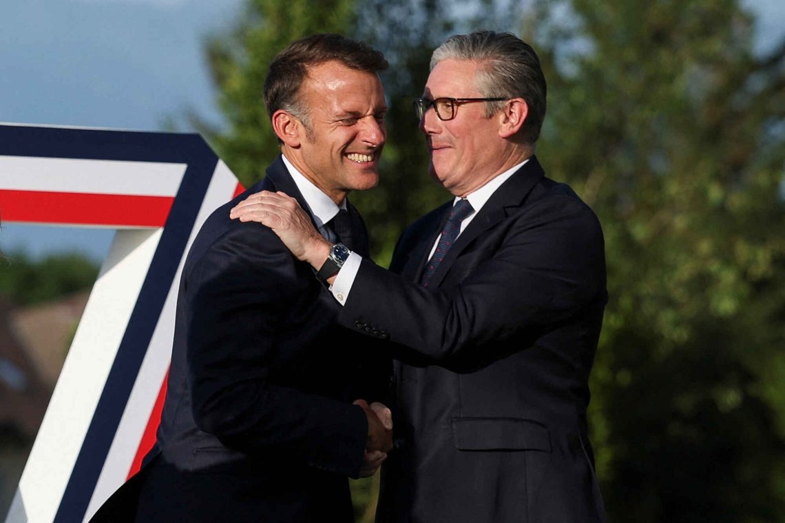 French President Emmanuel Macron greets Britain's Prime Minister Keir Starmer, right, during the official arrivals ceremony for the G7 summit in Evian-les-Bains, France, Monday, June 15, 2026. French President Emmanuel Macron greets Britain's Prime Minister Keir Starmer, right, during the official arrivals ceremony for the G7 summit in Evian-les-Bains, France, Monday, June 15, 2026.