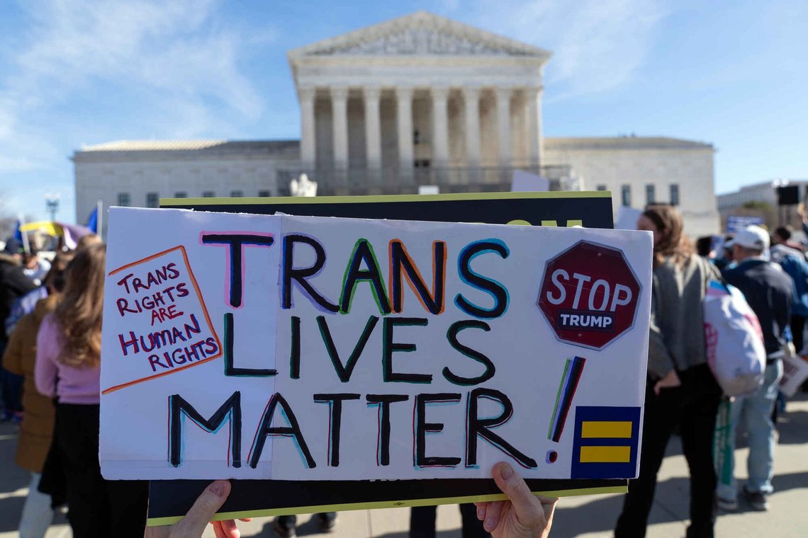 Protesters gather outside the Supreme Court as it hears arguments over state laws barring transgender girls and women from playing on school athletic teams, Tuesday, Jan. 13, 2026, in Washington. Protesters gather outside the Supreme Court as it hears arguments over state laws barring transgender girls and women from playing on school athletic teams, Tuesday, Jan. 13, 2026, in Washington.