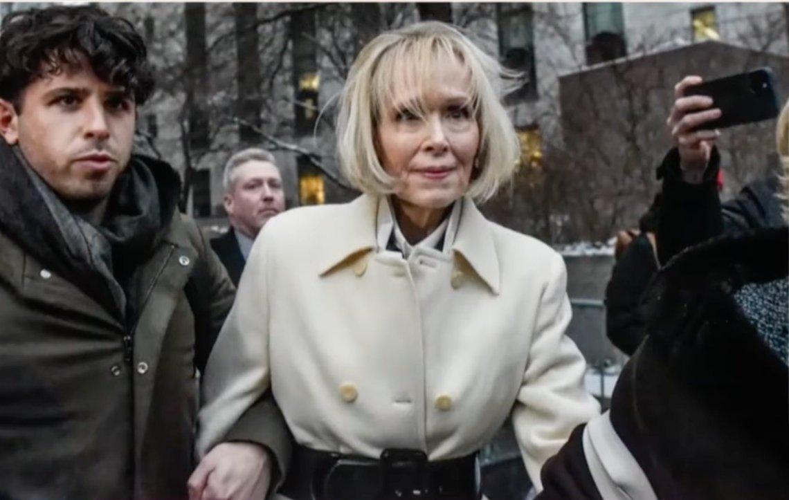 E. Jean Carroll, center, walks out of Manhattan federal court, Tuesday, Dec. 9, 2023, in New York. A jury has found Donald Trump liable for sexually abusing the advice columnist in 1996, awarding her $5 million in a judgment that could haunt the former president as he campaigns to regain the White House. Video still. E. Jean Carroll, center, walks out of Manhattan federal court, Tuesday, Dec. 9, 2023, in New York. A jury has found Donald Trump liable for sexually abusing the advice columnist in 1996, awarding her $5 million in a judgment that could haunt the former president as he campaigns to regain the White House. Video still.