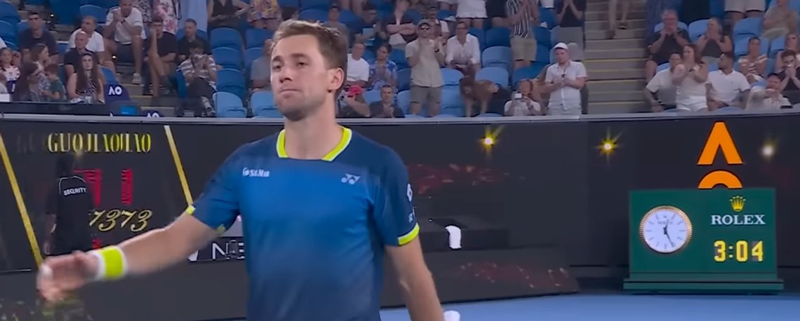 Casper Ruud on court during a tennis match. Casper Ruud on court during a tennis match.