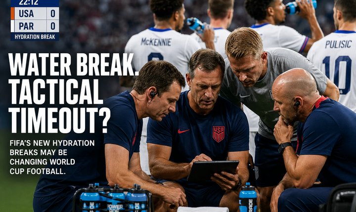U.S. coaches review tactics on a tablet during a World Cup hydration break,