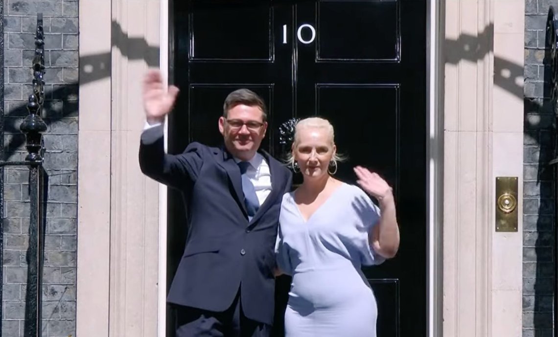 Britain's new Prime Minister, Andy Burnham, and his wife, Marie-France van Heel, outside 10 Downing Street in London. Video still. Britain's new Prime Minister, Andy Burnham, and his wife, Marie-France van Heel, outside 10 Downing Street in London. Video still.