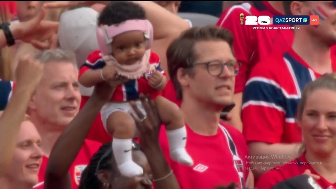 Baby held aloft during the FIFA World Cup Norway-Brazil match. Baby held aloft during the FIFA World Cup Norway-Brazil match.