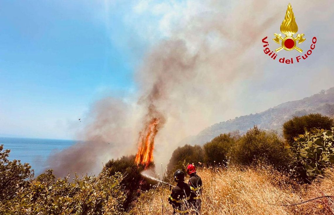 Firefighters from Italy's National Fire and Rescue Service (Vigili del Fuoco) battle a wildfire along the Italian coast as flames spread through dry vegetation. Photo: Vigili del Fuoco. Firefighters from Italy's National Fire and Rescue Service (Vigili del Fuoco) battle a wildfire along the Italian coast as flames spread through dry vegetation. Photo: Vigili del Fuoco.
