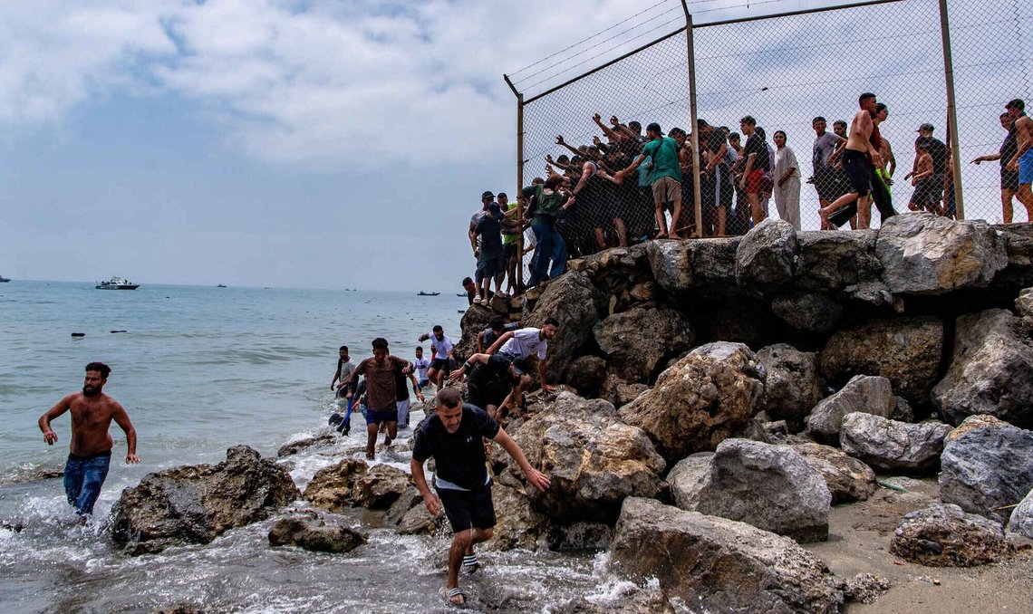 Migrants cross from Morocco into the Spanish enclave of Ceuta, Thursday, July 30, 2026. Migrants cross from Morocco into the Spanish enclave of Ceuta, Thursday, July 30, 2026.