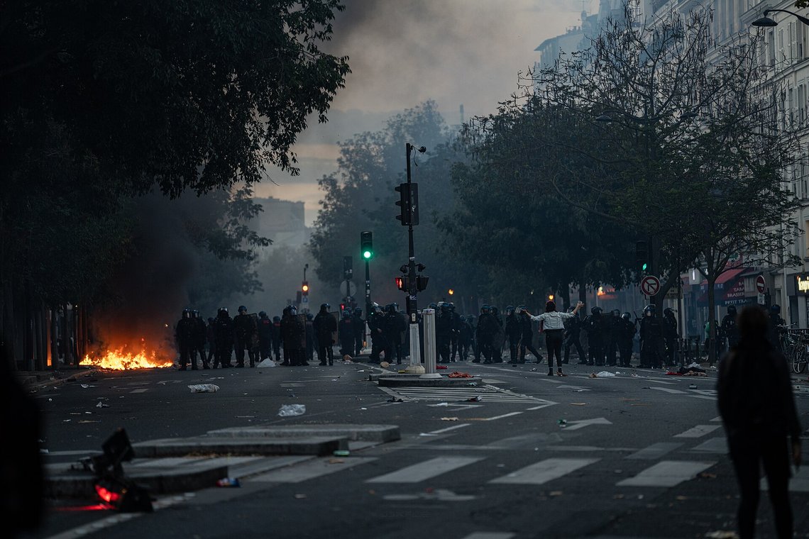 Protests and riots in Paris on 17 October 2026. Demonstrators gathered around Place de la République amid tear gas; cars and shared bikes were set on fire on Boulevard Voltaire and extinguished by the Paris Fire Brigade (BSPP); shops were looted, including a Chanel boutique in Le Marais at night. Photo: Wikimedia Commons CC BY-SA 4.0 Protests and riots in Paris on 17 October 2026. Demonstrators gathered around Place de la République amid tear gas; cars and shared bikes were set on fire on Boulevard Voltaire and extinguished by the Paris Fire Brigade (BSPP); shops were looted, including a Chanel boutique in Le Marais at night. Photo: Wikimedia Commons CC BY-SA 4.0