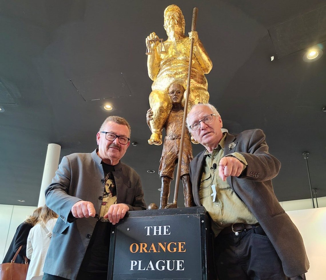 Danish artist Jens Galschiøt poses beside his sculpture The Orange Plague, depicting US President Donald Trump, which was exhibited at the European Parliament in Strasbourg on 7 October 2026. Photo: Galschiøt (no copyright). Danish artist Jens Galschiøt poses beside his sculpture The Orange Plague, depicting US President Donald Trump, which was exhibited at the European Parliament in Strasbourg on 7 October 2026. Photo: Galschiøt (no copyright).