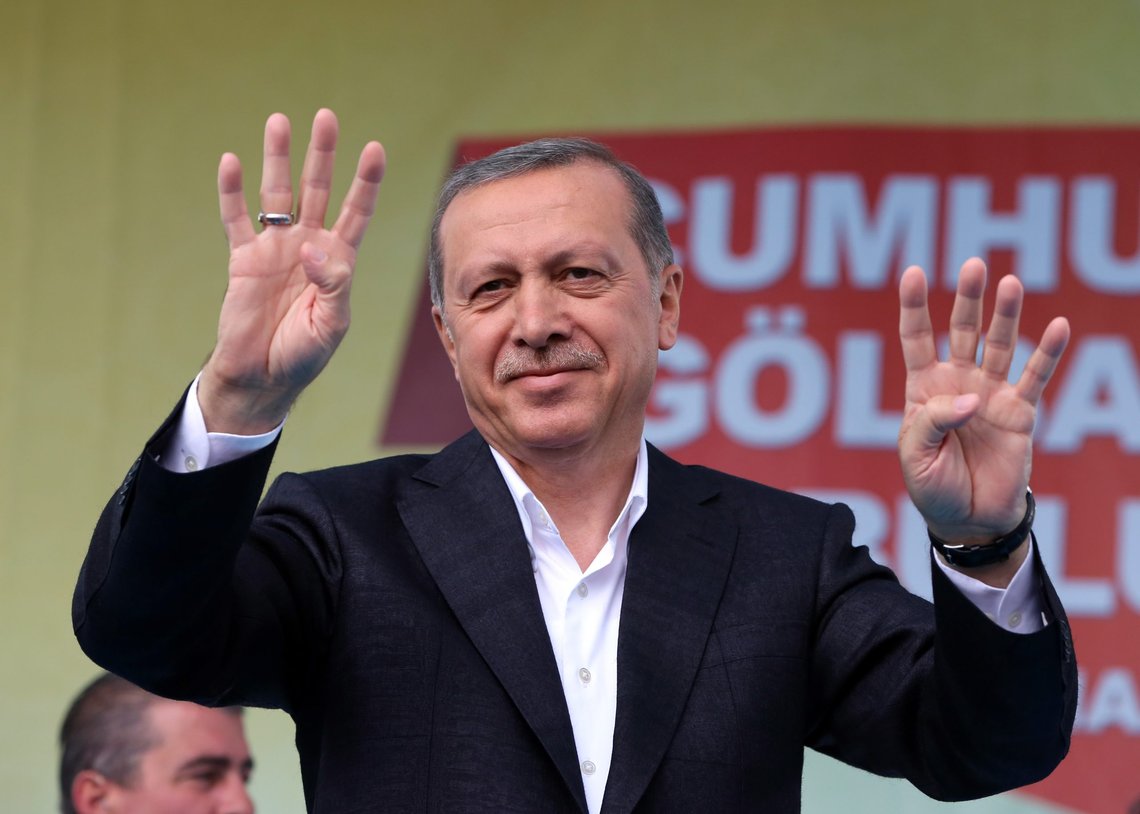 Turkey's President Recep Tayyip Erdogan salutes supporters as he addresses an election rally ahead of the upcoming June 7, 2015 general election in Golbasi, Ankara, Turkey, Friday, June 5, 2015. The overarching drama of the election has been whether Erdogans Justice and Development Party, or AKP, will win a strong enough majority to change the constitution and put Erdogan at the unquestioned pinnacle of Turkish politics in a new presidential system.(AP Photo/Burhan Ozbilici) Turkey's President Recep Tayyip Erdogan salutes supporters as he addresses an election rally ahead of the upcoming June 7, 2015 general election in Golbasi, Ankara, Turkey, Friday, June 5, 2015. The overarching drama of the election has been whether Erdogans Justice and Development Party, or AKP, will win a strong enough majority to change the constitution and put Erdogan at the unquestioned pinnacle of Turkish politics in a new presidential system.(AP Photo/Burhan Ozbilici)