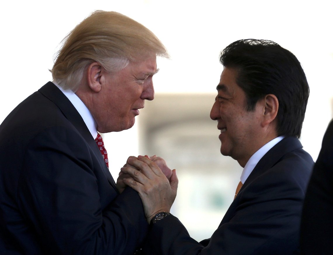 Japanese Prime Minister Shinzo Abe is greeted by U.S. President Donald Trump (L) ahead of their joint news conference at the White House in Washington, U.S., February 10, 2017. REUTERS/Joshua Roberts TPX IMAGES OF THE DAY Japanese Prime Minister Shinzo Abe is greeted by U.S. President Donald Trump (L) ahead of their joint news conference at the White House in Washington, U.S., February 10, 2017. REUTERS/Joshua Roberts TPX IMAGES OF THE DAY
