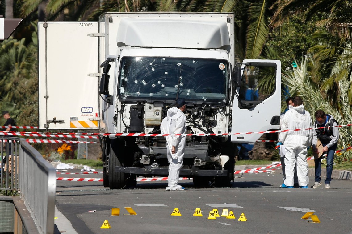 Investigators continue to work at the scene near the heavy truck that ran into a crowd at high speed killing scores who were celebrating the Bastille Day July 14 national holiday on the Promenade des Anglais in Nice, France, July 15, 2016. REUTERS/Eric Gaillard Investigators continue to work at the scene near the heavy truck that ran into a crowd at high speed killing scores who were celebrating the Bastille Day July 14 national holiday on the Promenade des Anglais in Nice, France, July 15, 2016. REUTERS/Eric Gaillard