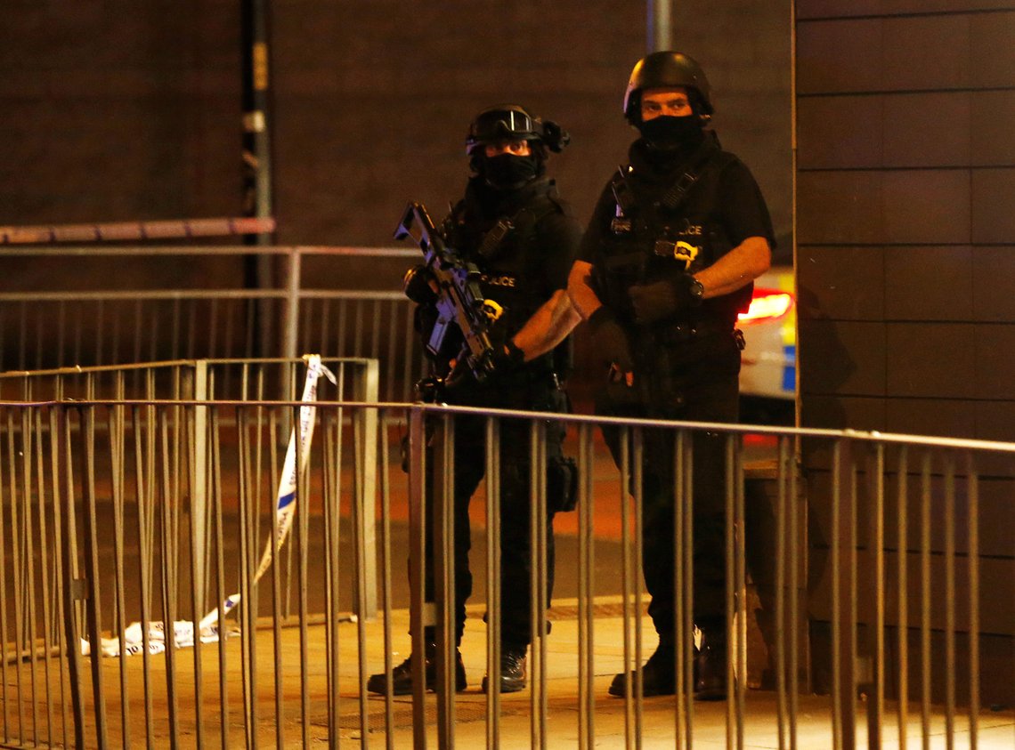Armed police officers stand next to a police cordon outside the Manchester Arena, where U.S. singer Ariana Grande had been performing, in Manchester, northern England, Britain, May 23, 2017. REUTERS/Andrew Yates Armed police officers stand next to a police cordon outside the Manchester Arena, where U.S. singer Ariana Grande had been performing, in Manchester, northern England, Britain, May 23, 2017. REUTERS/Andrew Yates