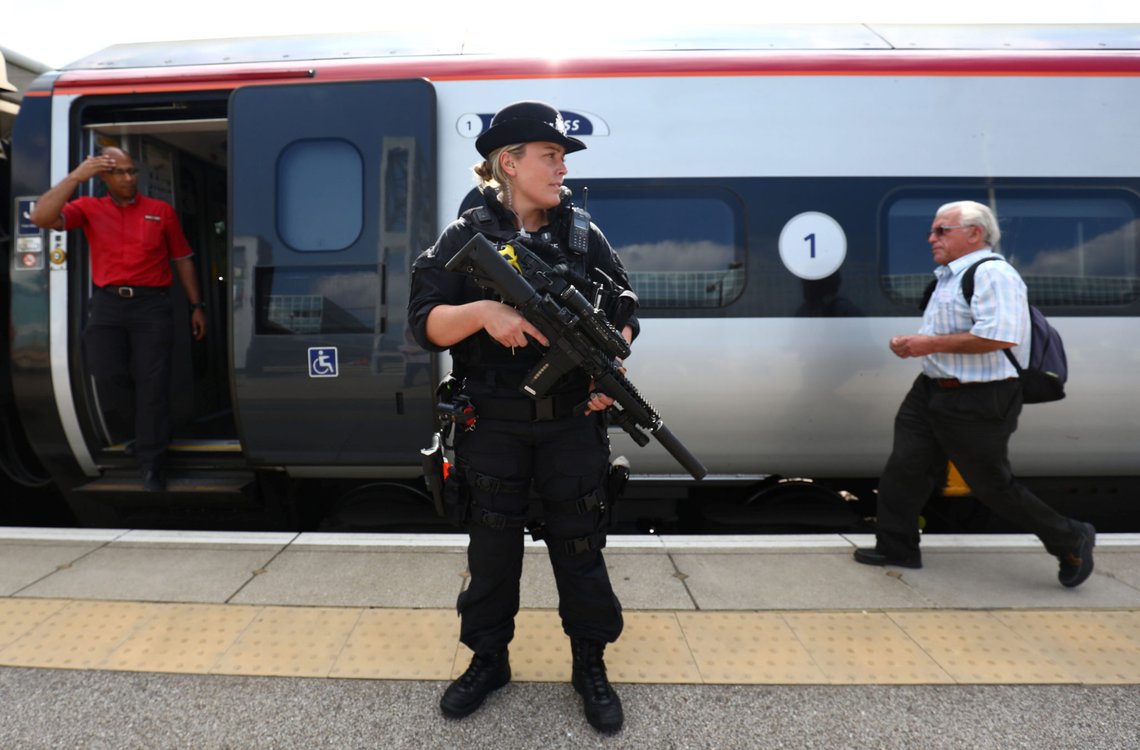 An armed police officer patrols on a platform at Milton Keynes station, Britain May 25, 2017. Armed police will patrol trains across Britain from Thursday for the first time, British Transport Police said, after the terror threat level was raised to critical following a suicide bombing in Manchester on Monday. REUTERS/Neil Hall An armed police officer patrols on a platform at Milton Keynes station, Britain May 25, 2017. Armed police will patrol trains across Britain from Thursday for the first time, British Transport Police said, after the terror threat level was raised to critical following a suicide bombing in Manchester on Monday. REUTERS/Neil Hall