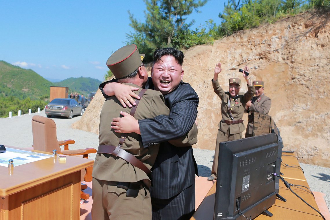 North Korean leader Kim Jong Un reacts with scientists and technicians of the DPRK Academy of Defence Science after the test-launch of the intercontinental ballistic missile Hwasong-14 in this undated photo released by North Korea's Korean Central News Agency (KCNA) in Pyongyang July, 5, 2017. KCNA/via REUTERS ATTENTION EDITORS - THIS IMAGE WAS PROVIDED BY A THIRD PARTY. REUTERS IS UNABLE TO INDEPENDENTLY VERIFY THIS IMAGE. NO THIRD PARTY SALES. SOUTH KOREA OUT. TPX IMAGES OF THE DAY North Korean leader Kim Jong Un reacts with scientists and technicians of the DPRK Academy of Defence Science after the test-launch of the intercontinental ballistic missile Hwasong-14 in this undated photo released by North Korea's Korean Central News Agency (KCNA) in Pyongyang July, 5, 2017. KCNA/via REUTERS ATTENTION EDITORS - THIS IMAGE WAS PROVIDED BY A THIRD PARTY. REUTERS IS UNABLE TO INDEPENDENTLY VERIFY THIS IMAGE. NO THIRD PARTY SALES. SOUTH KOREA OUT. TPX IMAGES OF THE DAY